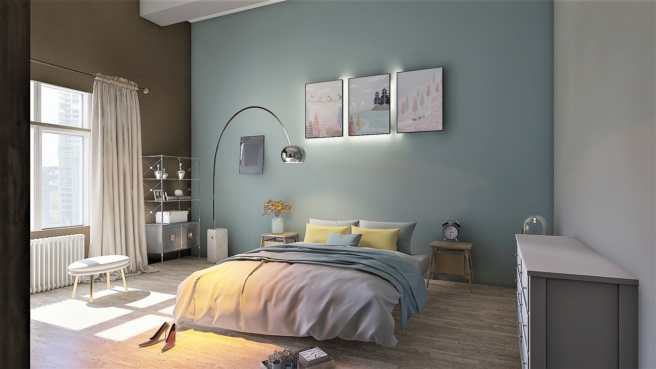 Two colour combination for bedroom walls featuring a soft teal accent wall paired with dark brown walls and yellow bedding.